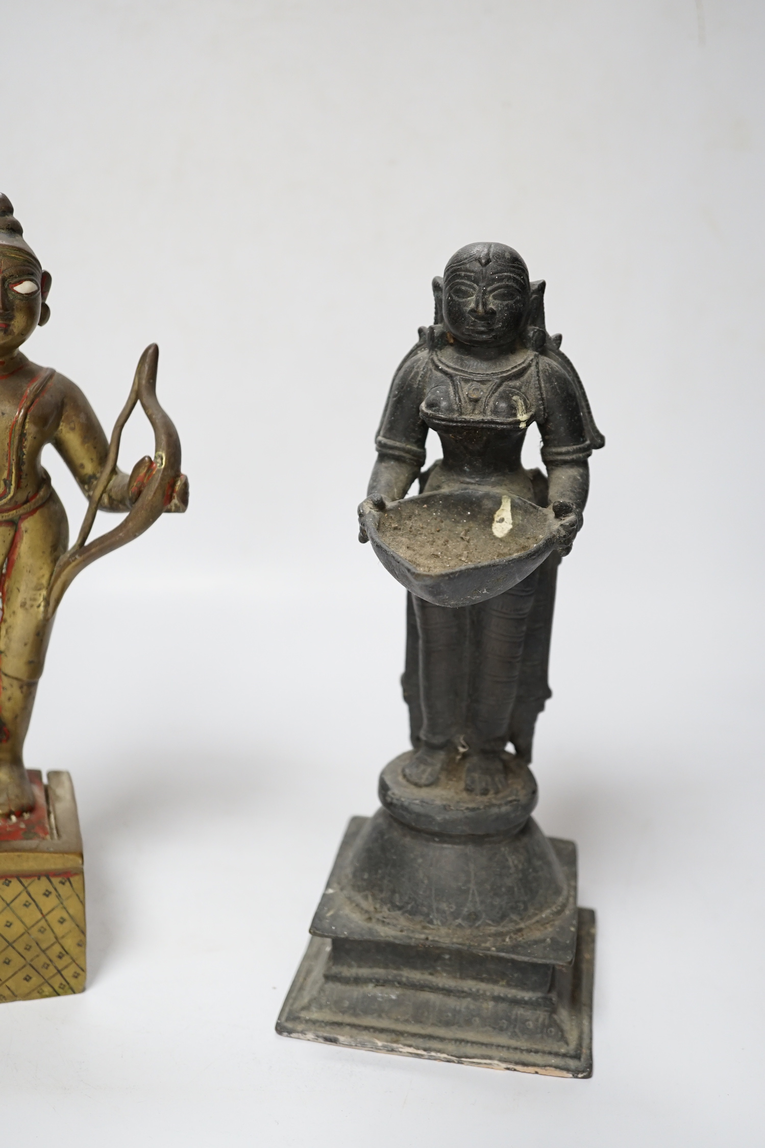 A 19th century Indian ‘Deepalakshni’ butter oil lamp and an 18th century Indian brass figure of Kodanda Rama (quiver of arrows lacking) tallest 26cm